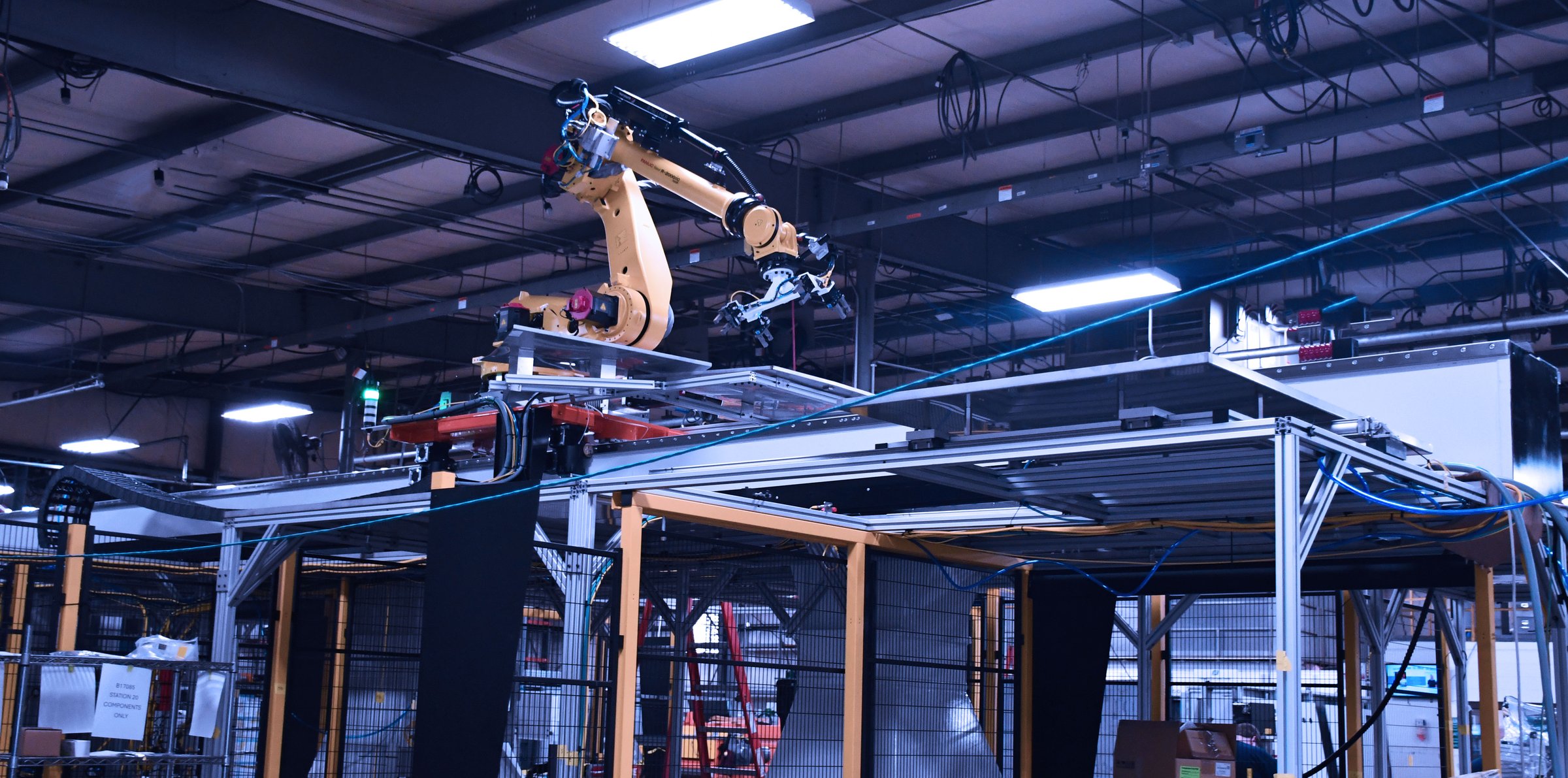 Close-up of a Güdel robotic arm integrated by Integrion Automation
