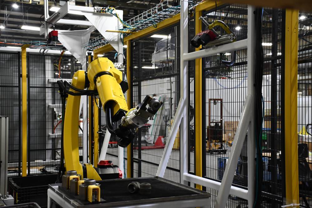 FANUC bin pick robot with 3D vision camera picking bung parts in the cap and bung cell