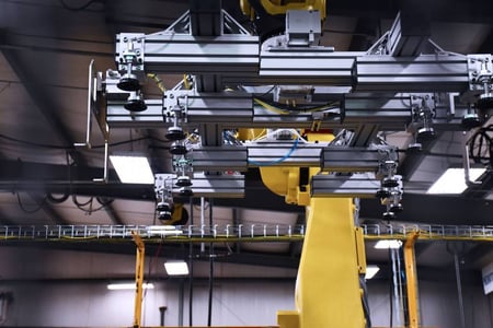 Vacuum end-of-arm tool on a robot used to handle EV battery covers